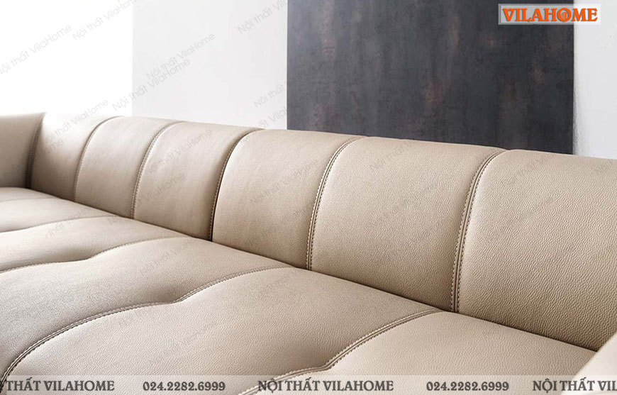 Sofa văng da màu trắng ngà với các đường trang trí kẻ sọc